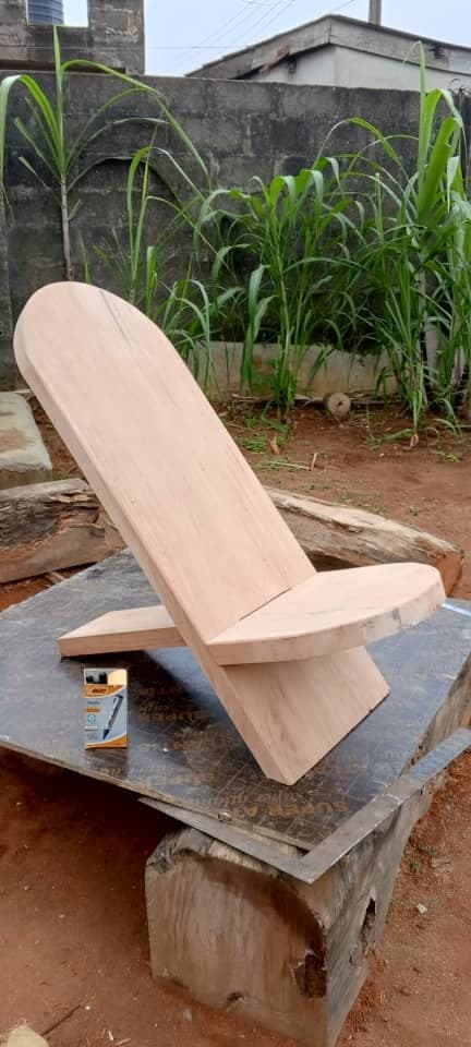 A plain hardwood chair before carving