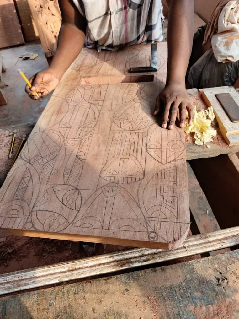 Drawing the pattern by hand onto the wood
